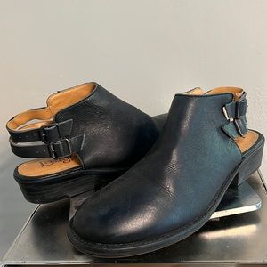 Leather strap covered black shoes